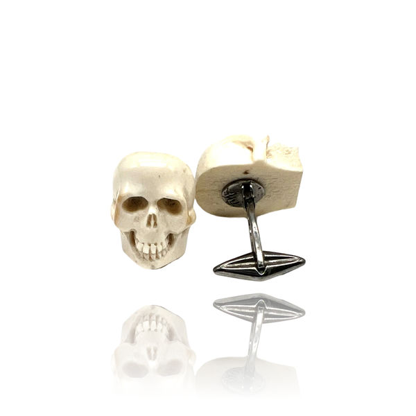 Silver cufflinks with bone skulls