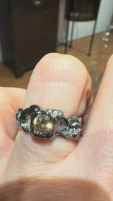 18 kt Black Gold Dentini Ring with central brown diamond and white small diamonds